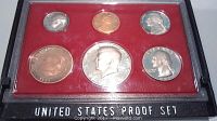 Front view of the 1982 United States proof coin set showing six coins arranged in red velvet-lined case with clear cover. Includes Lincoln Cent, Jefferson Nickel, Roosevelt Dime, Washington Quarter, Kennedy Half Dollar, and Susan B. Anthony Dollar.