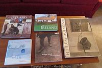Six books arranged on a wooden table showing art and Ireland themes, including three Andrew Wyeth and two Ireland-related books.
