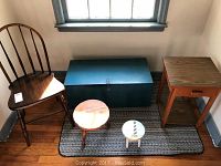 View of all five furniture items together - Windsor chair, blue wooden box, two wooden stools, small end table