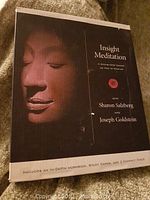 Box set cover with serene Buddha face and title Insight Meditation by Sharon Salzberg and Joseph Goldstein.