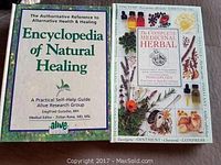 Photo showing two books on natural healing and herbal medicine.