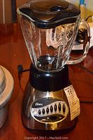 Oster blender with glass jar and metal base