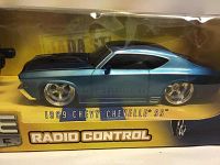 Photo showing side view of the 1969 Chevy Chevelle SS RC car inside box highlighting blue color, black stripes and chrome wheels