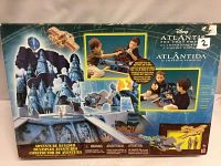 Back side of box showing thematic Atlantis play set artwork and illustrations of children playing with the set.