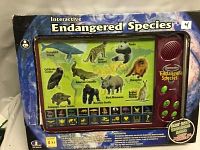 Front of the boxed interactive endangered species educational game showing images of the 10 featured animals and the interactive panel with speaker and buttons.