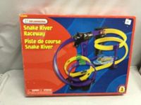Box of Kids Connection Snake River Raceway track set showing colorful loops and snake head tunnel with two racing cars.