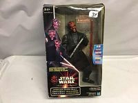 Front view of the Darth Maul figure inside original packaging, showing box art and figure details.