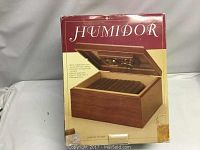 Original boxed cigar humidor showing product image and specifications on packaging.