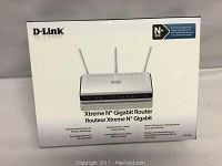 Front of the box showing product name and features including award-winning wireless technology and gigabit ports.