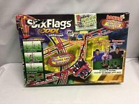 Front of box showing Six Flags Cool Coasters branding and key features including motorized power, real coaster sounds, and screams.