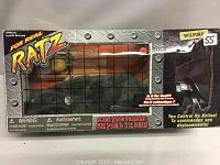 Full view of the boxed remote control rat named Wilford, featuring cage-style window on the box front.