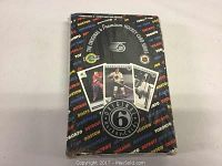 Sealed black box with colorful team names and images of vintage hockey cards