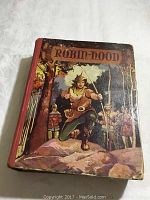 Front cover of vintage Robin Hood children's book showing color illustration and red spine.