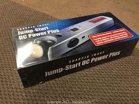 Box showing front and side displaying the product name and image of the device.