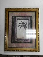 Full view of ornate gold frame with raised palm tree artwork inside, showing framing and artwork details.