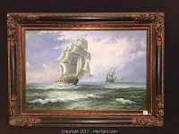 Full view of framed oil painting showing two sailing ships at sea