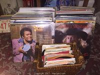 Front view showing vinyl records rows with Charley Pride and Joe N Anderson albums visible