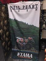 Full front view of silk banner hung, showing text, imagery, and color