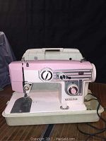 Front view of the vintage White sewing machine showing overall condition and power cord.