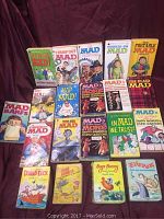 Photo of the full collection showing 18 books, mostly Mad themed from the 1970s and 1980s, and classic 60s Big Little Books with cartoon characters.