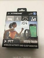 Front of the Xtreme Xfit wireless activity and sleep monitor box showing tracking features and app compatibility.