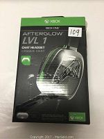 Boxed Afterglow LVL 1 Chat Headset for Xbox One showing front packaging with product image and Xbox branding.