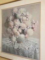 Close-up of the framed decorative print showing white flowers in a vase on lace tablecloth, signed Hoff, numbered 103/1800.