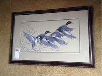 Full view of the framed print depicting ducks in flight.