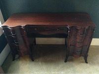 Front view of seven-drawer wood vanity