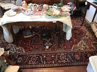 Full view of rug under table showing overall size and pattern