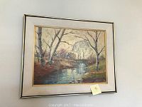 Full view of framed painting hanging on wall