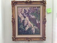 Full view of the framed oil painting depicting wild white wisteria flowers with a wooden fence in the background.