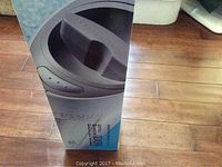 Front view of the box showing the image of the Ionic Breeze Quadra air purifier and partial branding