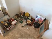 Overall view of all kitchenware and fabric fruit box labels arranged on floor corner