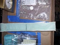 Tiffany & Co light blue velvet pouch in a cardboard box