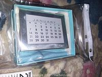 Calendar frame in its original Tiffany & Co. box with January calendar displayed.