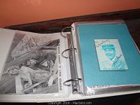 Open white cloth binder showing autographed black and white photo of Jennifer Holt with Johnny Downs