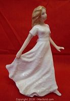 Side view of the Royal Doulton Friendship figurine showing detail of figure and dress.