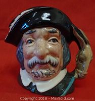 Front view of Royal Doulton Sancho Panca Toby Jug highlighting detailed facial features, tricorn hat, and animal-shaped handle.