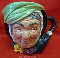 Close-up front view of the Royal Doulton Toby Jug showing Sairy Gamp's detailed face and colorful glaze.