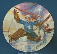 Collector plate featuring hockey goalie artwork titled 'Goalie Save' by Stewart Sherwood, signed on the front.