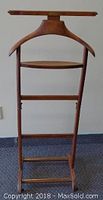 Front view of the 1950s Birkdale men's valet stand showing the full structure including hanger, shelf, and base bars.