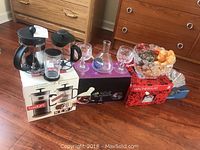 Photo showing all items including fruit bowl, candy dish, wine carafe, wine glasses, and boxed Bodum cappuccino set.