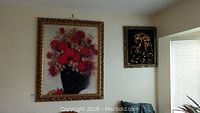 Photo showing both framed artworks on wall, large floral print and smaller horse painting
