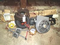 Full assortment of electrical supplies including wires, duct fan, fixture, metal boxes, and tools.