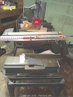 Full view of the Craftsman table saw and joiner combination frame showing saw blade area, rip fence, clamps, and manual miter saw behind