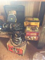 Overall view of three routers, bases and boxed accessories on shelf