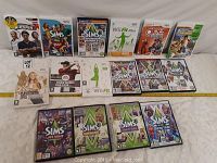 Photo showing 15 Nintendo Wii game cases including multiple Sims titles and others