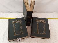 Set of three vintage Larousse du XXe Siècle hardcover books with black covers and gold lettering, arranged on a white surface.