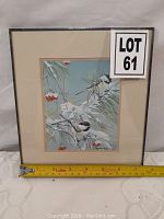 Front view of matted and wood-framed print with LOT 61 label and measuring tape at base